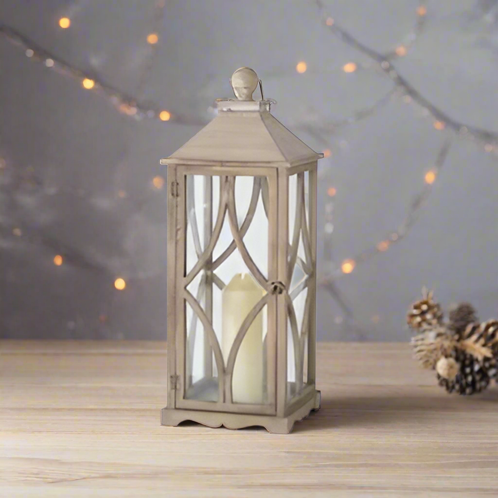 Decorative lantern with a beige finish on a white background