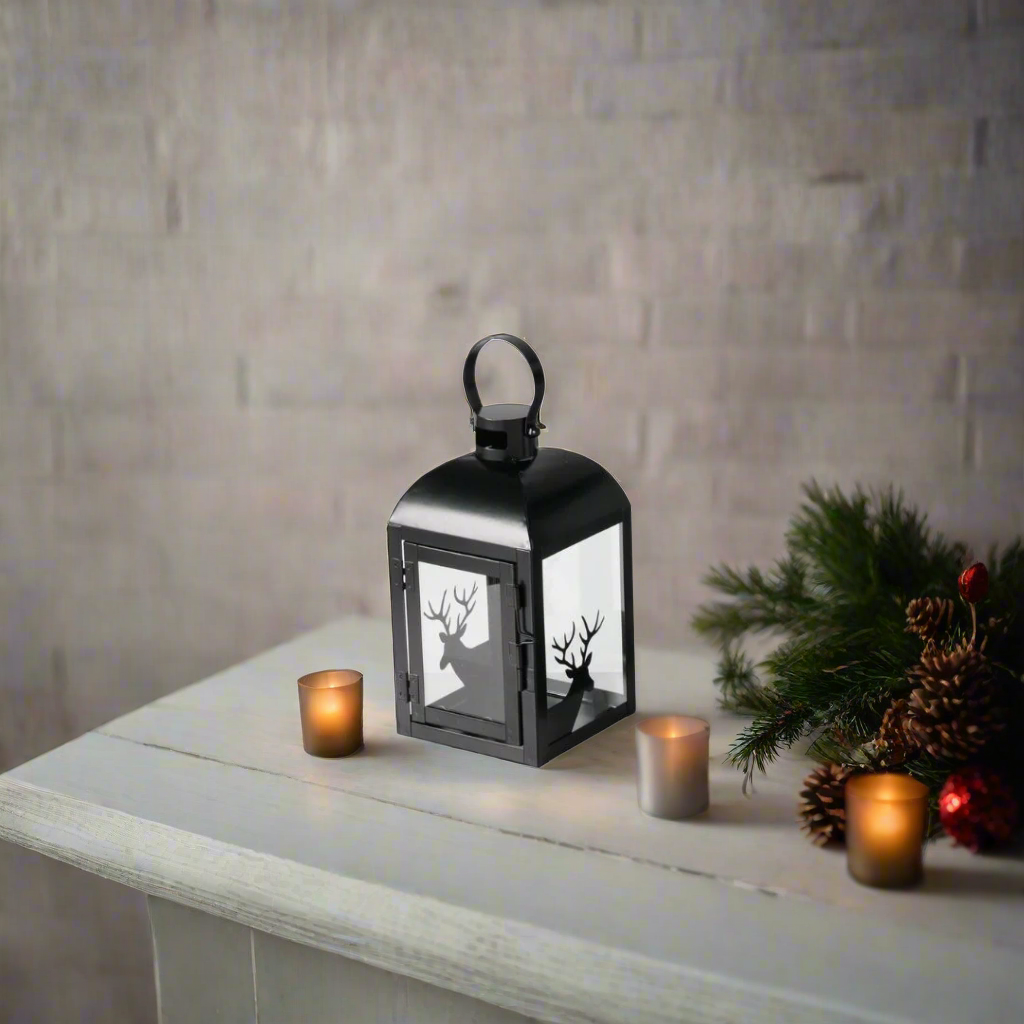 Black lantern with deer silhouette design on a white background
