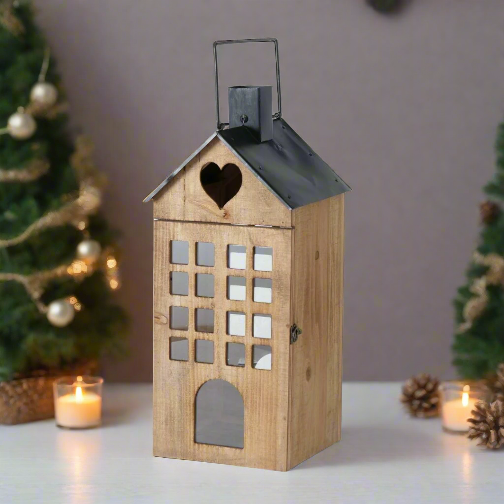 Wooden lantern with a heart-shaped window on a white background
