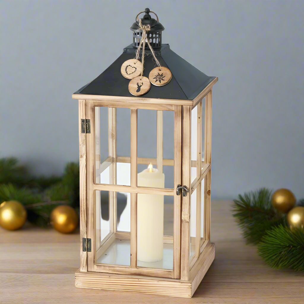 Wooden lantern with glass panels and decorative elements on a white background