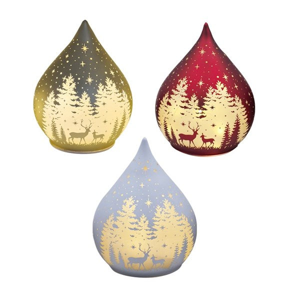 Three teardrop-shaped lamps with forest and deer design on a white background